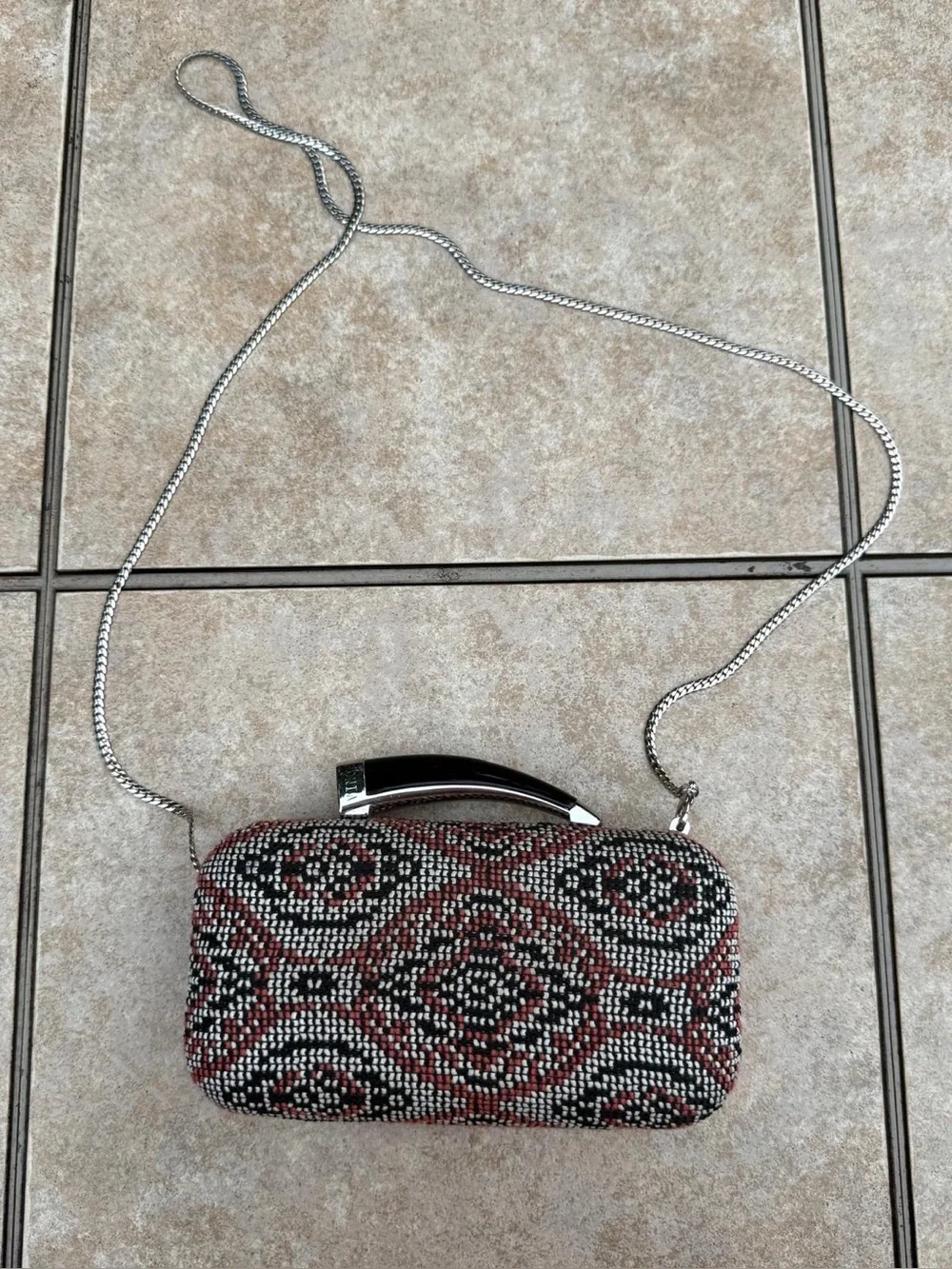 Vince Camuto textured clutch bag with a crossbody chain